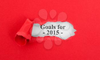Text appearing behind torn red envelop - Goals for 2015
