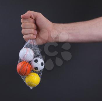 Small toy balls isolated on black background