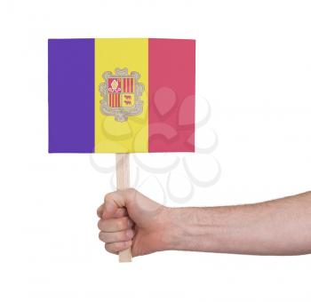 Hand holding small card, isolated on white - Flag of Andorra