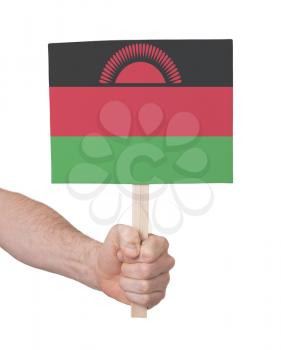 Hand holding small card, isolated on white - Flag of Malawi