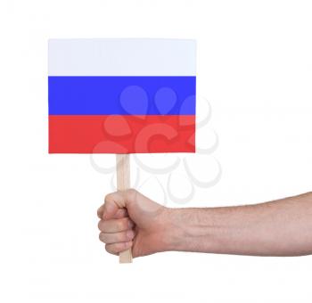 Hand holding small card, isolated on white - Flag of Russia