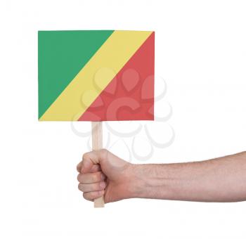 Hand holding small card, isolated on white - Flag of Congo