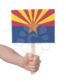 Hand holding small card, isolated on white - Flag of Arizona