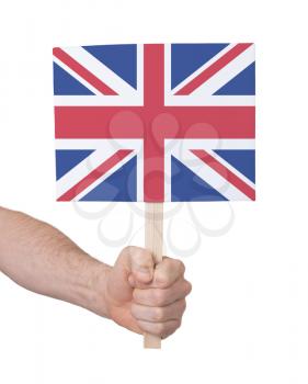 Hand holding small card, isolated on white - Flag of the UK