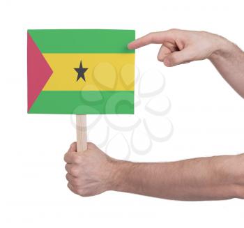 Hand holding small card, isolated on white - Flag of Sao Tome and Principe