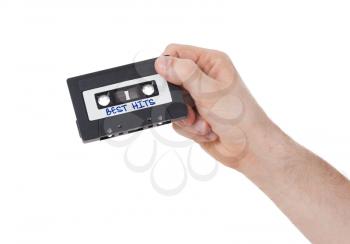 Vintage audio cassette tape, isolated on white background, best hits