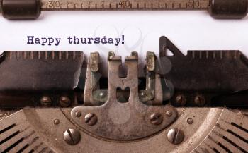Vintage typewriter close-up - Happy Thursday, concept of motivation