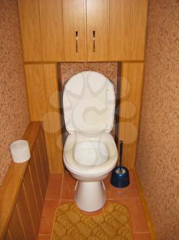 the image of white toilet bowl in brown toilet
