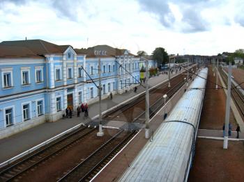 the image of building of railway station and rails