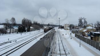 image of panorama to railway station and rails in winter