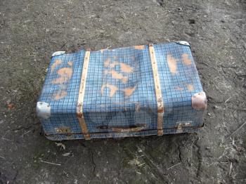 image of old suitcase on the ground