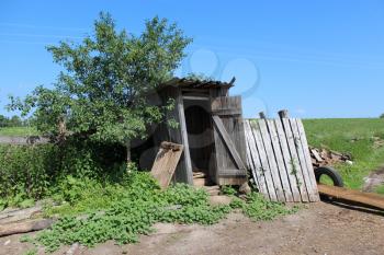 image of rural toilet on background of blue sky