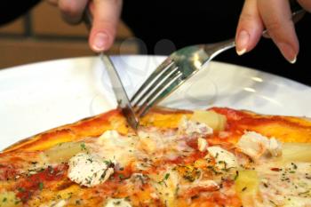 image of knife fork and tasty pizza with appetizing stuffing