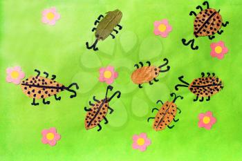 Children's odd with beetles with pink flowers on the green background