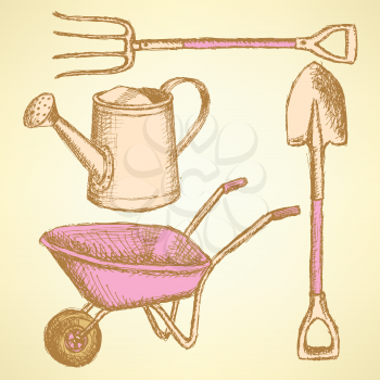 Garden fork, barrow, watering can and shovel, vintage background