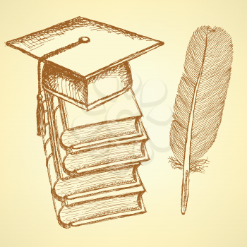Sketch books with graduation cap on the top and feather pen