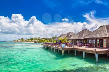 MALDIVES - JUNE 24, 2018: Water Villas (Bungalows) at Tropical beach in the Maldives at summer day