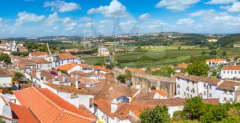 Panoramic aerial view of medieval town Obidos in a beautiful summer day, Portugal