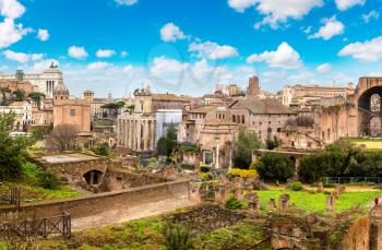Ancient ruins of forum and Victor Emmanuel II monument in a winter day in Rome, Italy