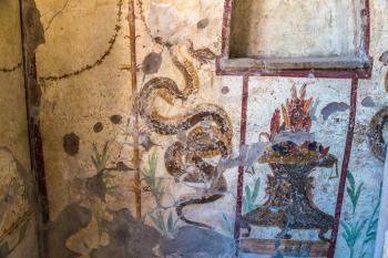 Painted wall in Pompeii city destroyed in 79BC by the eruption of volcano Vesuvius, Italy in a beautiful summer day