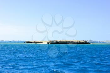Island in the Sea. Sea Blue Water Background.