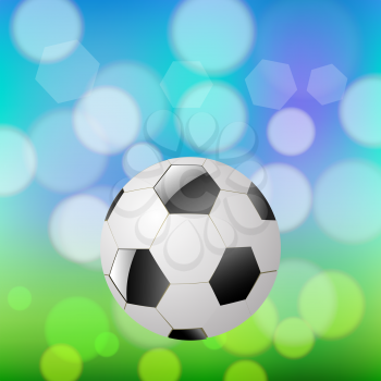 New Soccer Ball on Summer Blurred Background. 