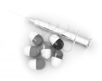 Pills and syringe on a white background