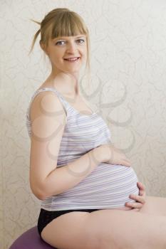 Image of pregnant woman in light clothes