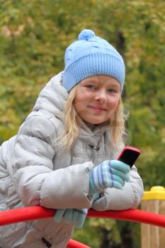 Portrait of small girl with cellular phone