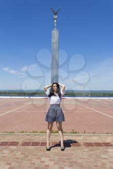 Caucasian brunette woman on Samara monument background
