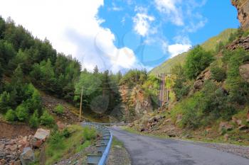 Landscape of road and lift in Caucasus green mountains