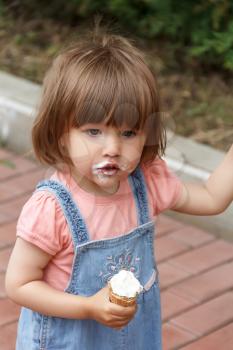 Photo of cute girl are eating icecream in summer