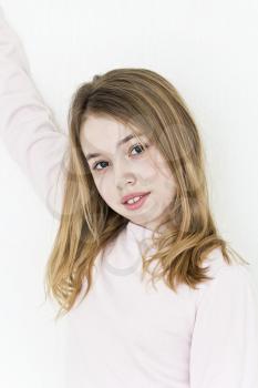 Cute teenager girl white wall in pink clothes