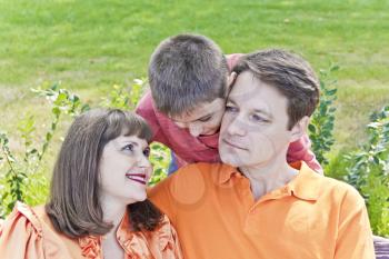 Portrait of happy family with mother father and son
