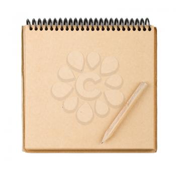 Brown paper notepad with small pencil isolated on white