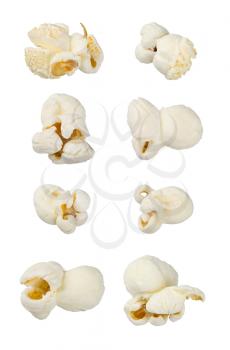 Single popcorns isolated on white. Extra large macro set. Extreme close up. Junk food, dessert, snack concept.