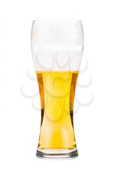 Tall beer glass almost full with lager beer, in the process of drinking. Someone already took a sip from the glass. Isolated on white