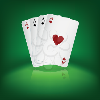 Four aces playing cards on green background