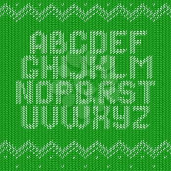 Knitted alphabet on green background. Christmas crochet font on knitted classic ornament pattern. All the letters are on different layers, it is convenient to produce words and sentences