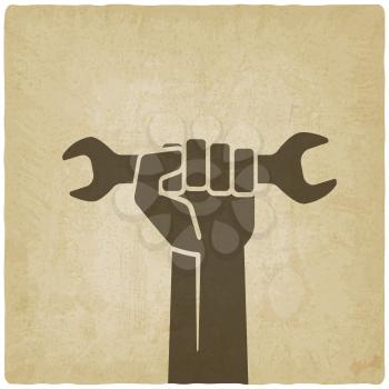 worker hand with wrench symbol old background - vector illustration. eps 10