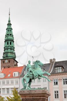 view on tower St. Nicholas Church and Statue of Absalon in Copenhagen, Denmark 