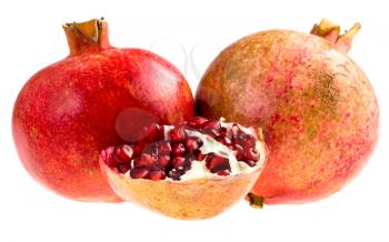 two whole  and half of broken pomegranates isolated on white