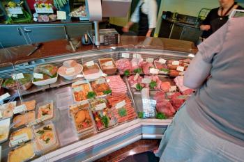 meat and delicacies in in small butcher shop in France