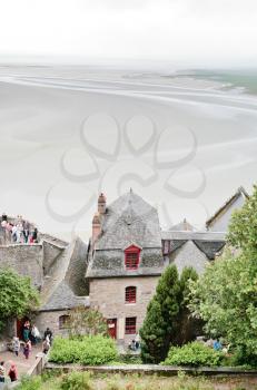 MONT SAINT-MICHEL, FRANCE - JULY 5: tidal sea bottom around Mont Saint-Michel. More than 3000000 people visit Saint Michael's Mount each year, in France on July 5, 2010.