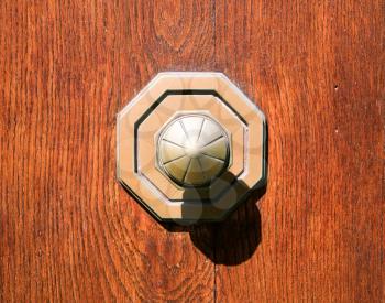 old doorknob at wooden door
