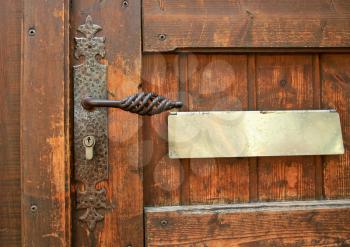 ancient handle at wooden door