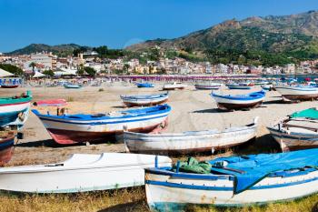 old boats on  beach Gardini Naxos in summer day, Sicily, Italy