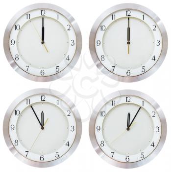 set of twelve o clock on the dial round wall clock isolated on white background