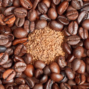 instant coffee and roasted coffee beans close up