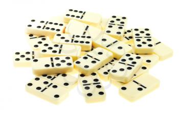 pile of scattered dominoes on isolated white background